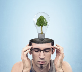 open minded man with green energy symbol