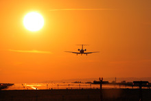 Jet Airplane Is Approaching Rwy At Sunset