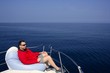 © lunamarina - Man on bow boat relaxed on bean bag