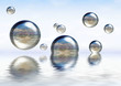 glassy spheres floating on the water