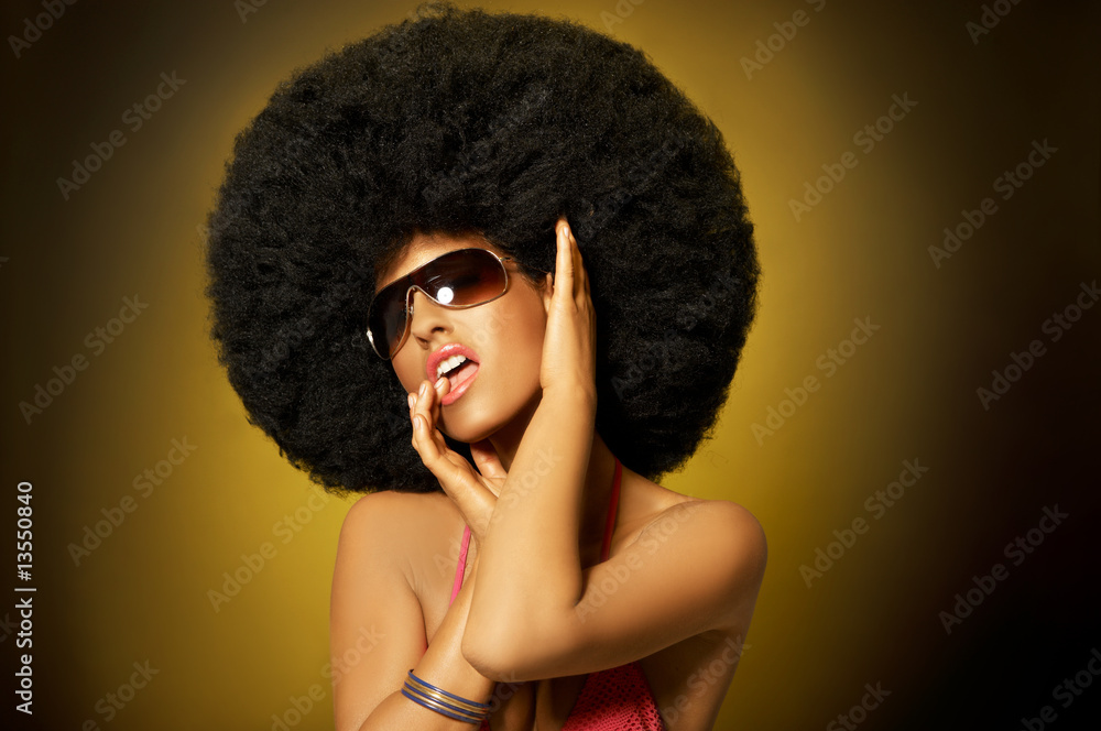Beautiful woman with huge afro haircut on yellow - obrazy, fototapety, plakaty 
