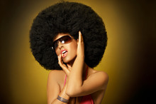 Beautiful Woman With Huge Afro Haircut On Yellow