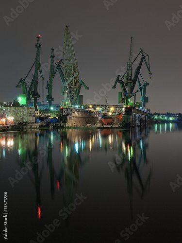 Obraz w ramie And cranes of Gdansk shipyard, Poland.