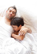 © WavebreakMediaMicro - Father and Son asleep on bed