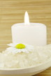 bath salt and candle on wooden background