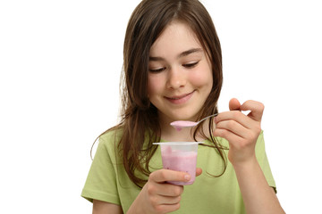 Wall Mural - Girl eating yogurt isolated on white background