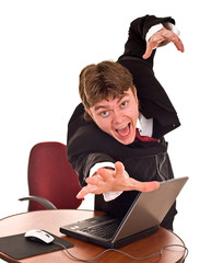 Businessman with laptop in office.