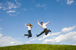 © Eduard Stelmakh - Happy smiling couple  jumping in blue sky