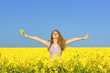 © originalpunkt - woman in rape(canola) field enjoying the open air