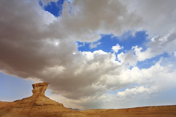 Sticker - Huge cloud of the freakish form above stone desert.