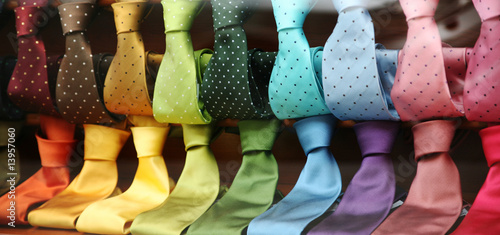 Stampa su Tela  Varicolored Ties in a shopwindow
