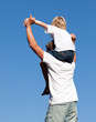 © WavebreakMediaMicro - Father with his son on his back