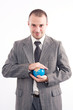 © Andreea Ardelean - Successful business man with globe over a white background