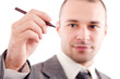 © Andreea Ardelean - Young businessman with pen - the hand is in focus