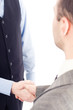 © Andreea Ardelean - Two business men handshaking, isolated on white