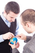 © Andreea Ardelean - Successful business maen with globe over a white background