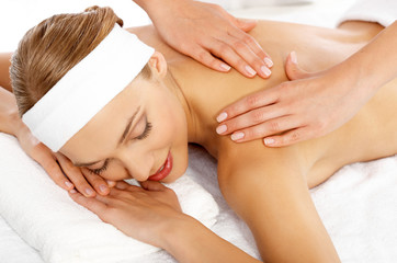 Young beautiful and relaxed lady taking spa treatment