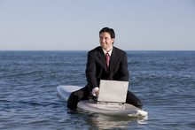 Surfing Businessman
