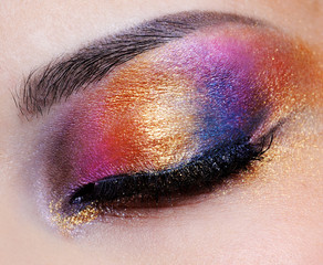 closed eye with multicoloured eyeshadow