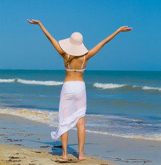 Wall Mural - Girl in white under the sun