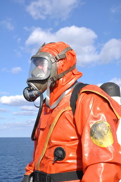 Fototapete - man in chemical suit