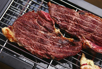 Canvas Print - juicy roast meat on black bbq