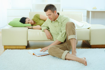 Wall Mural - Man reading book at home