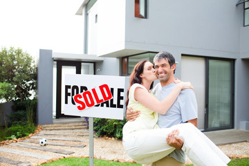 Wall Mural - Couple celebrating their new house