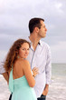 © Stephen Orsillo - attractive couple at ocean he is looking at sea she is looking a
