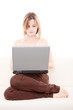 © Andreea Ardelean - Woman with laptop on the couch