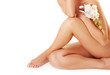 © Nejron Photo - Female legs with white orchid