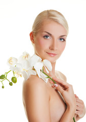 Beautiful young woman with white orchid