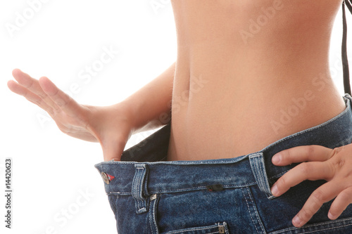 Fotografia Female became skinny and wearing old jeans