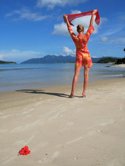 Wall Mural - Young woman on a sandy beach. Langkawi, Malaysia