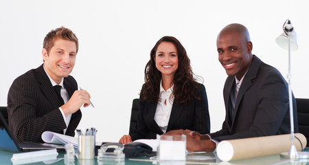 Business team in a meeting looking at the camera