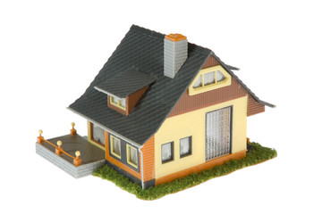 Wall Mural - Miniature  house isolated on white background