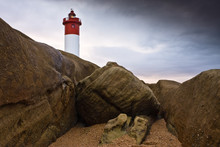 Lighthouse On Rocks