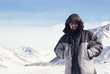 Alpinist in winter mountain