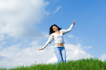 happy young woman dreams to fly on winds