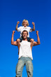 © WavebreakMediaMicro - Strong son sitting on his father's shoulders