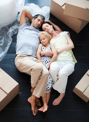 Canvas Print - Parents and daughter sleeping on the floor