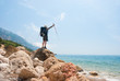 © Anton Gvozdikov - Hikers on a stony sea shore