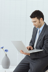 Businessman using laptop computer