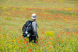 © Anton Gvozdikov - Happy hiker on a poppy field