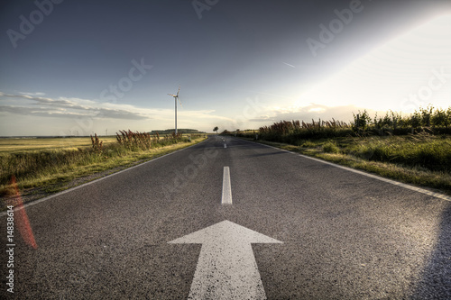 Fotografia  Country Asphalt road in strong flare