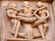 Leinwanddruck Bild - Stone carved erotic sculptures in hindu Khajuraho temple, India