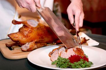 Chef cutting duck in chineese restaurant