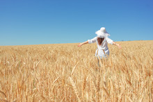 Happy Girl In Grain Field
