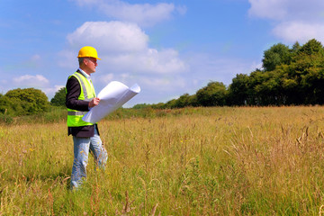 architect surveying a new building plot