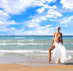 Wall Mural - Woman enjoying the sea